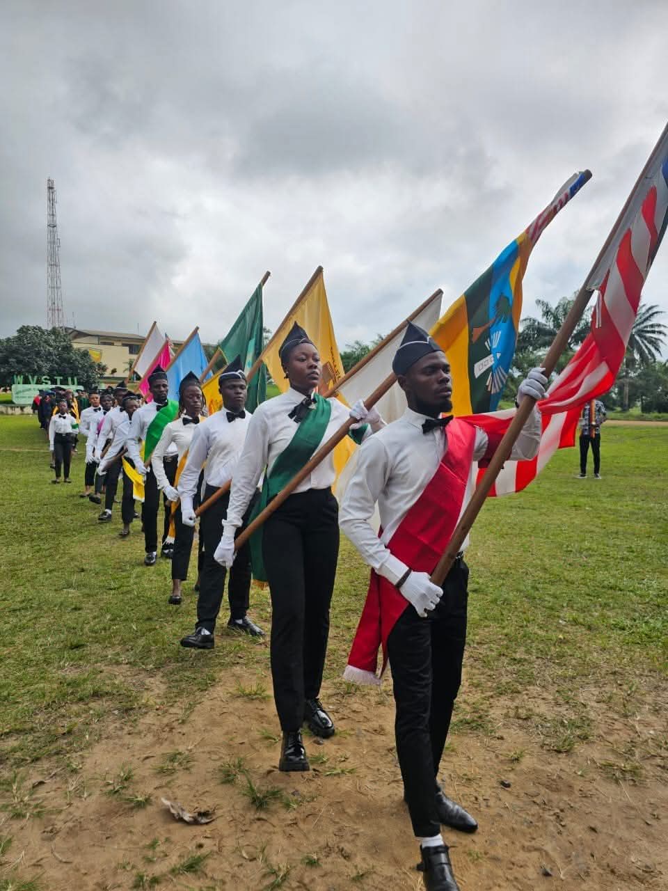Tubman University campus approach with flags